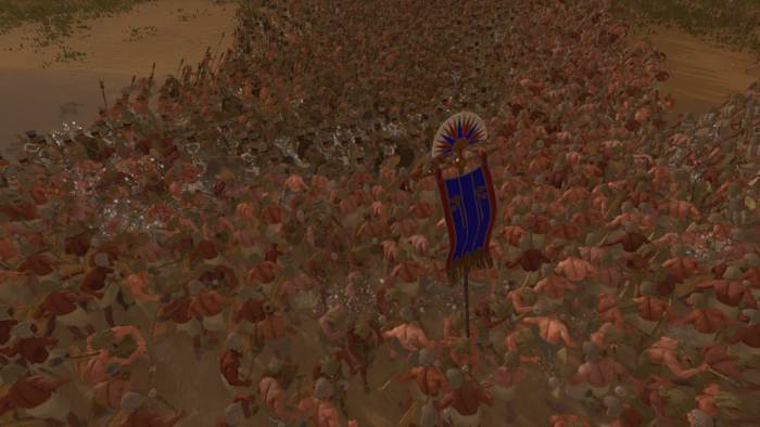 Total War: Pharaoh screenshot showing a chaotic melee in a river.
